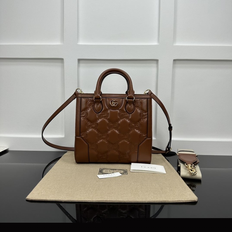 G*u*i top handle bags